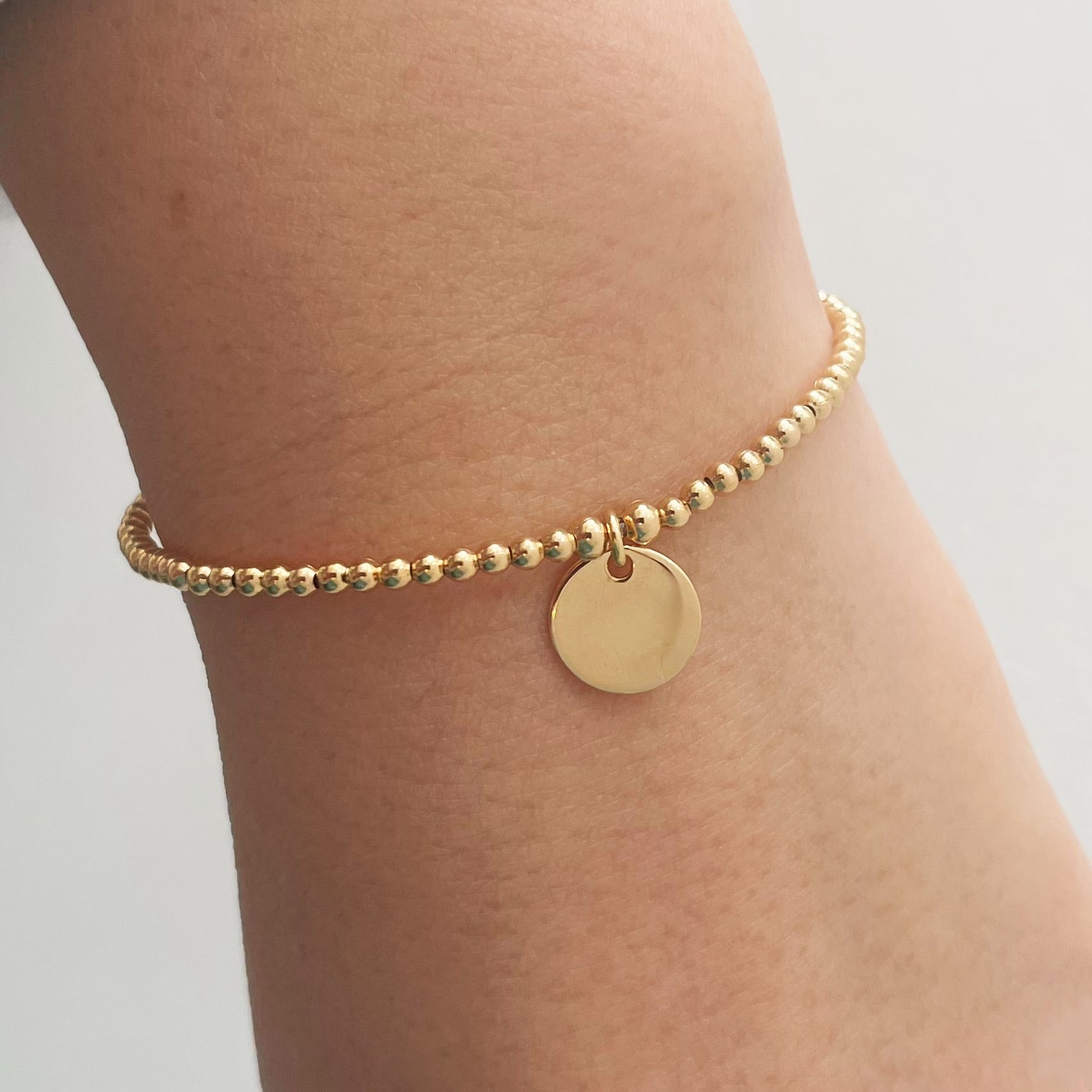 bracelet billes et médaille- plaqué or