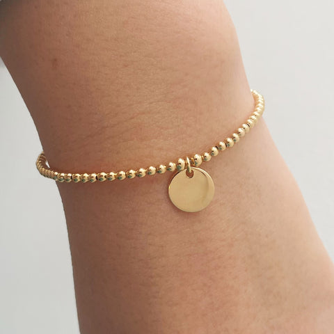 bracelet billes et médaille- plaqué or